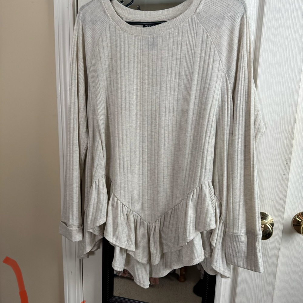 Elegant Cream Ruffle Hem Top